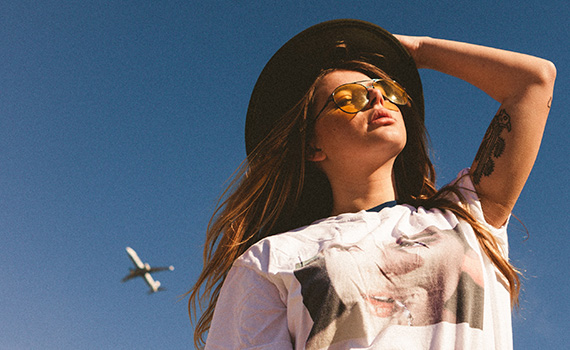 Outdoor fashion portrait under a blue sky